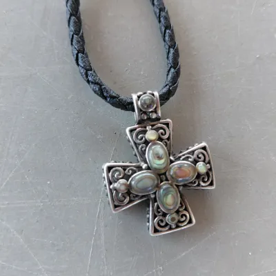 Sale Photo Thumbnail #213: Sterling Silver Cross with Abalone/Mother of Pearl on Black Braided chain.