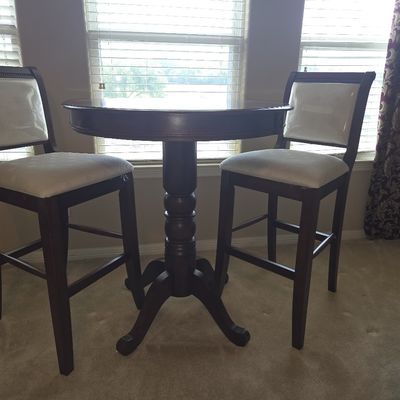 Wood Pub Table with Two Upholstered Bar Stools.