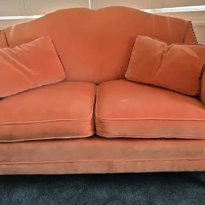 Antique Pink Velvet Settee With Studded arms And Scrolled Back