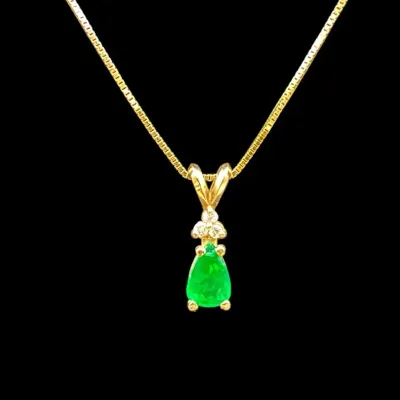 Emerald And Diamond Pendant In 14k Gold On 14k Box Chain 