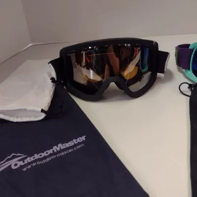 Three Pairs of Ski Goggles- Two Outdoormaster and One Bolle