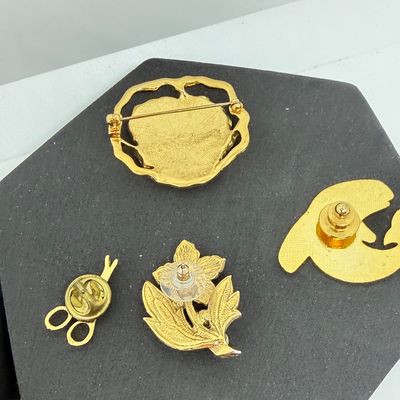 LOT 327: Gold Tone Pin Collection