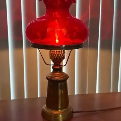 Hurricane Style Lamp With Ruby Red Shade On A Brass Base