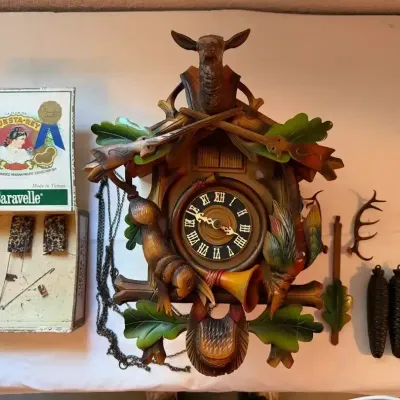 German Black Forest Hunting Theme (Jagdstck) Musical Cuckoo Clock made in Switzerland