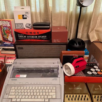 Typewriter, tubular extension speaker, and Vintage radios