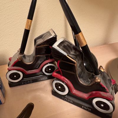 Desk pin holders in the shape of Ford car models