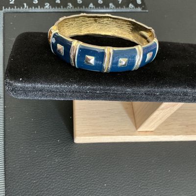 Sale Photo Thumbnail #47: Gold toned hinged bracelet with navy blue Enamel 
Please see attached pictures