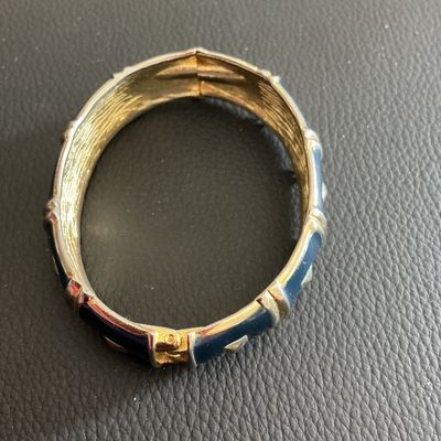Sale Photo Thumbnail #51: Gold toned hinged bracelet with navy blue Enamel 
Please see attached pictures