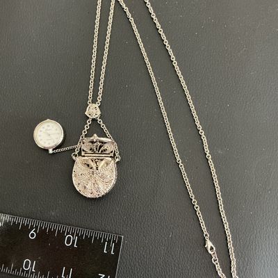Sale Photo Thumbnail #9: Vintage silver tone necklace with hand bag pendant with hidden watch untested 
Please see attached pictures