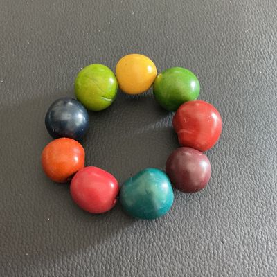 Sale Photo Thumbnail #44: Multi Colored Tagua nut stretchy bracelet 
Please see attached pictures