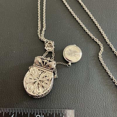 Sale Photo Thumbnail #13: Vintage silver tone necklace with hand bag pendant with hidden watch untested 
Please see attached pictures