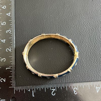 Sale Photo Thumbnail #49: Gold toned hinged bracelet with navy blue Enamel 
Please see attached pictures