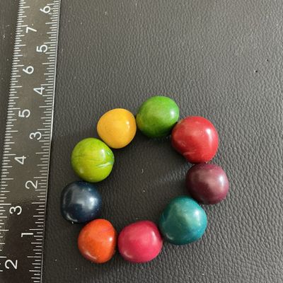 Sale Photo Thumbnail #45: Multi Colored Tagua nut stretchy bracelet 
Please see attached pictures
