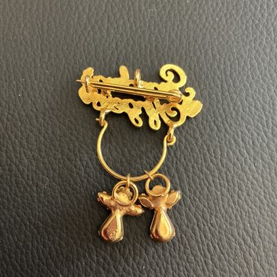 Sale Photo Thumbnail #81: Grandma angles brooch with little angel charms 
Please see attached pictures
