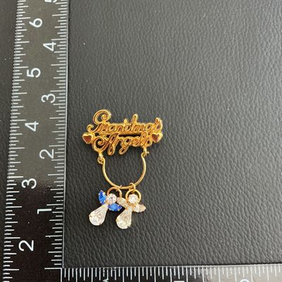 Sale Photo Thumbnail #83: Grandma angles brooch with little angel charms 
Please see attached pictures