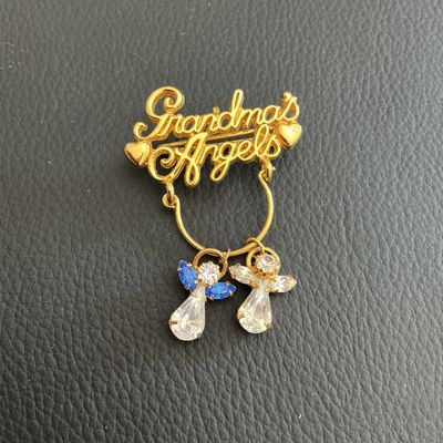 Sale Photo Thumbnail #79: Grandma angles brooch with little angel charms 
Please see attached pictures