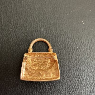 Sale Photo Thumbnail #67: Vintage Gold Tone purple enamel hand bag brooch 
Please see attached pictures