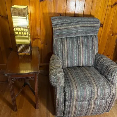 Stylish Recliner with Multicolor Striped Pattern with Wooden Side table and Tall Rattan Lamp