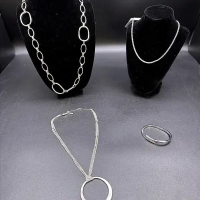 Silver-toned Necklaces And A Hinged Bracelet 