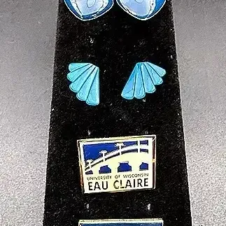 Blue Toned Jewelry Lot Featuring Two UWEC Pins