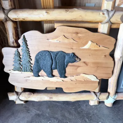 Sale Photo Thumbnail #7: Log-framed panel with relief-carved black bear, pines and mountains; twine-lashed log rails