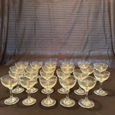 collection of vintage clear glass champagne coupe glasses