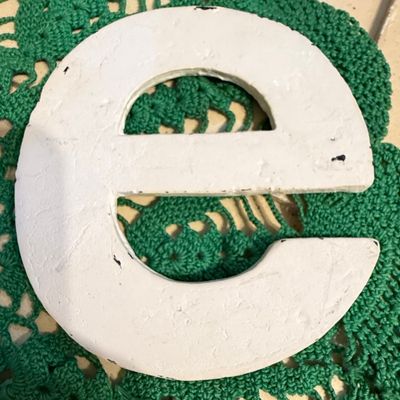 Distressed White Metal Letter 'e'