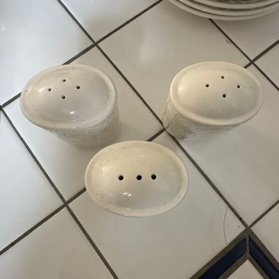 Sale Photo Thumbnail #634: White Embossed Ceramic Salt and Pepper Shakers with Floral/Fruit Pattern