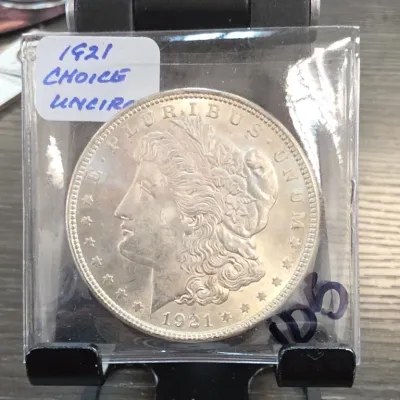 Sale Photo Thumbnail #192: 1921 Morgan Dollar Coin in Plastic Sleeve