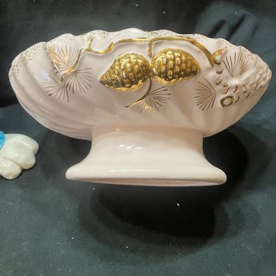Sale Photo Thumbnail #1312: WCL CERAMIC EASTER BUNNY FIGURINES AND GOLDEN PINE PN-4 FOOTED BOWL. INCLUDES TWO CERAMIC BUNNY FIGURES WITH WCL MARKINGS AND ONE PINK FOOTED BOWL WITH GOLD PINE CONE ACCENTS. LIGHT WEAR, NO VISIBLE CHIPS OR CRACKS.