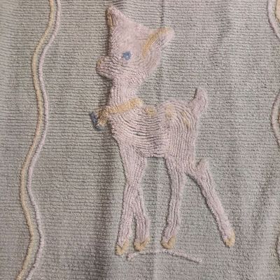 Sale Photo Thumbnail #1153: 38”x65” Blue vintage cotton chenille baby crib blanket or coverlet featuring a tufted white fawn or deer design in the center with pastel floral accents