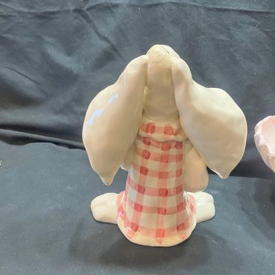 Sale Photo Thumbnail #1307: WCL CERAMIC EASTER BUNNY FIGURINES AND GOLDEN PINE PN-4 FOOTED BOWL. INCLUDES TWO CERAMIC BUNNY FIGURES WITH WCL MARKINGS AND ONE PINK FOOTED BOWL WITH GOLD PINE CONE ACCENTS. LIGHT WEAR, NO VISIBLE CHIPS OR CRACKS.