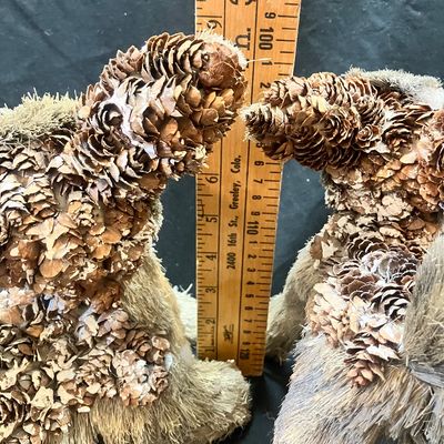 Sale Photo Thumbnail #1239: SET OF 2 DEER FIGURINES MADE FROM NATURAL BRISTLE AND PINECONES. MEASURES APPROXIMATELY 8 INCHES TALL. GOOD CONDITION WITH LIGHT WEAR.