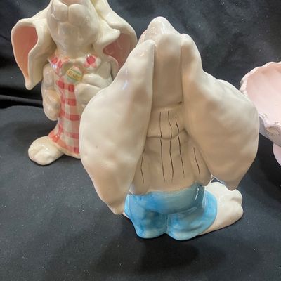 Sale Photo Thumbnail #1309: WCL CERAMIC EASTER BUNNY FIGURINES AND GOLDEN PINE PN-4 FOOTED BOWL. INCLUDES TWO CERAMIC BUNNY FIGURES WITH WCL MARKINGS AND ONE PINK FOOTED BOWL WITH GOLD PINE CONE ACCENTS. LIGHT WEAR, NO VISIBLE CHIPS OR CRACKS.