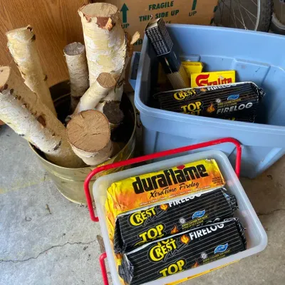 Duraflame & Crest Top Fire Logs With Birch Logs In A Metal Container