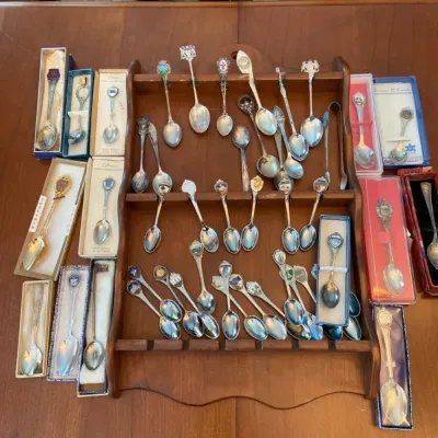 Collection Of Teaspoon Souvenirs With Spoon Display