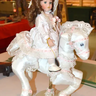 Porcelain doll on carousel