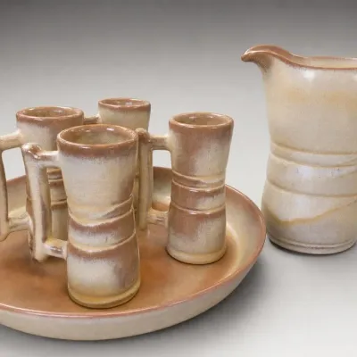 Glazed Ceramic Pitcher With Four Mugs and Tray