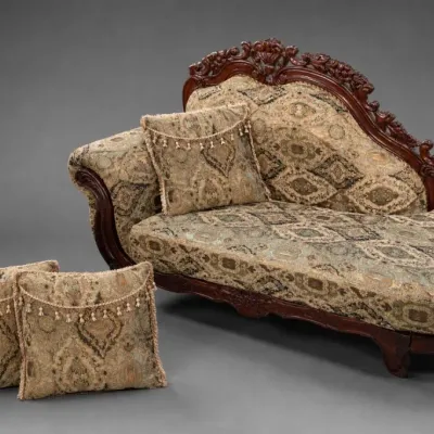Carved Wood and Upholstered Chaise Lounge With Pillows