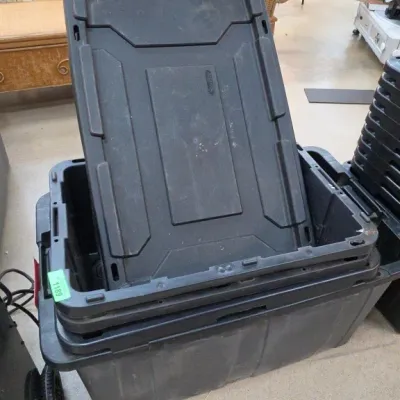 Stacked Black Plastic Storage Totes With Lids