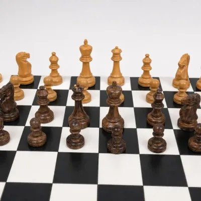 Wood Chess Pieces on Black and White Board