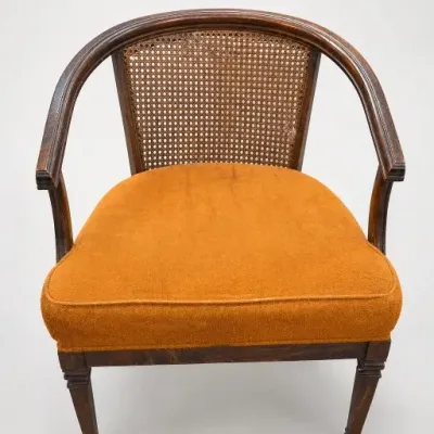Wood Armchair With Cane Back and Orange Seat