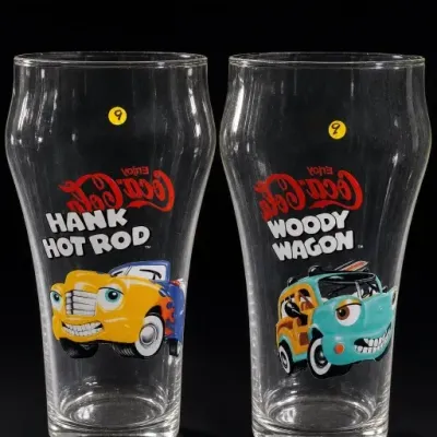 Sale Photo Thumbnail #189: Pair of Enjoy Coca-Cola Hank Hot Rod and Woody Wagon Glasses