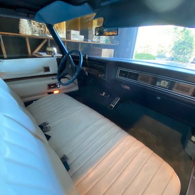 1972 Cadillac Eldorado convertible with white leather interior.