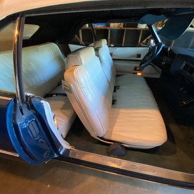 1972 Cadillac Eldorado convertible with white leather interior.