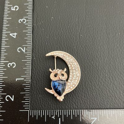 Sale Photo Thumbnail #212: Very nice rose gold toned moon and owl brooch with clear rhinestones 
Please see attached pictures