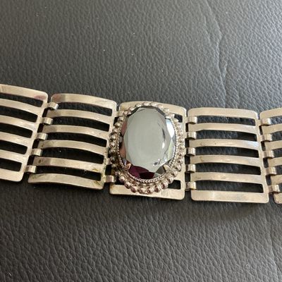 Sale Photo Thumbnail #171: Silver Tone ladder link statement bracelet with mirrored hematite style stone has wearing blemishes 
Please see attached pictures