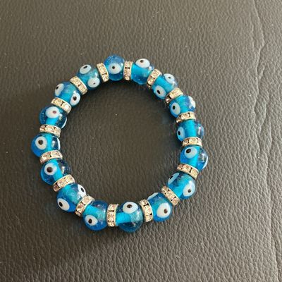Sale Photo Thumbnail #174: Light blue Glass evil Eye stretchy bracelet 
Please see attached pictures