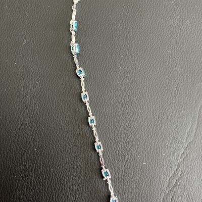 Sale Photo Thumbnail #89: Beautiful Silver Tone Bracelet with blue rhinestones 
Please see attached pictures 
((((((Please note that this bracelet is not 925)))))