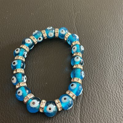 Sale Photo Thumbnail #180: Light blue Glass evil Eye stretchy bracelet 
Please see attached pictures